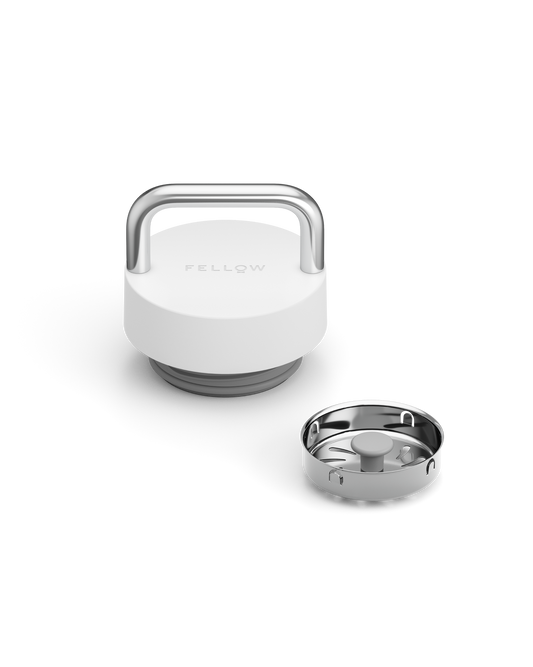 White and silver Fellow The Carry Lid with separate stainless steel bottom piece beside it.