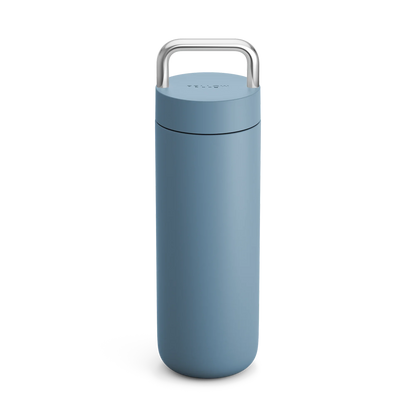 Fellow Carter Carry Travel Mug, tall blue with silver handle, shown on a white background.