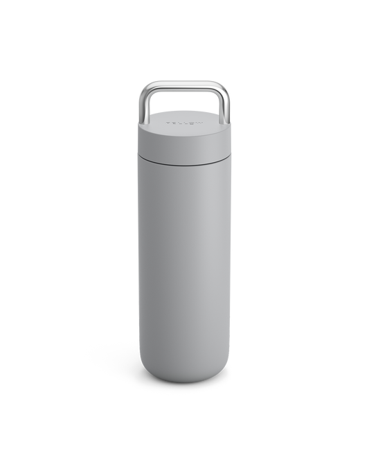 Fellow Carter Carry Travel Mug in Matte Grey with silver handle on a plain white background.