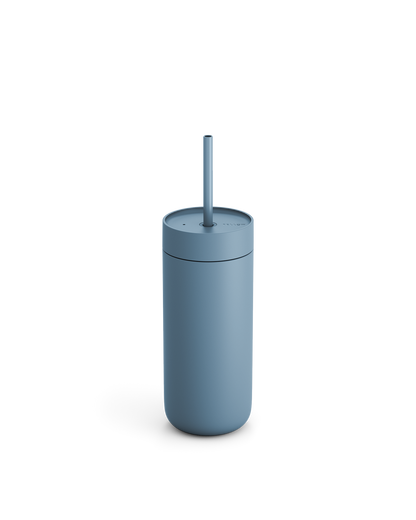 Fellow Carter Cold Tumbler in matte blue with lid and straw, on a plain white background.