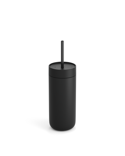 Fellow Carter Cold Tumbler in matte black with lid and straw on a white background.