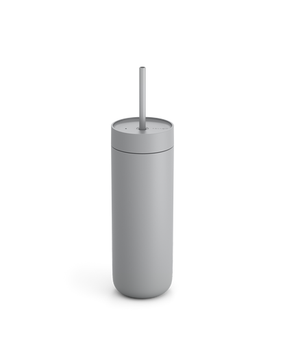 Fellow Carter Cold Tumbler in matte gray with lid and straw, shown on white background.