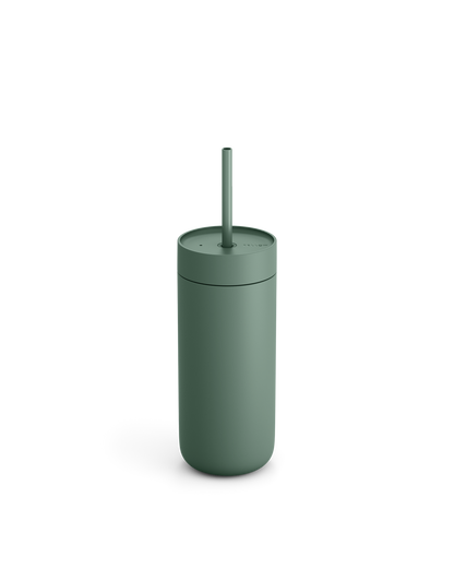 Fellow Carter Cold Tumbler in matte green with lid and straw on a white background.