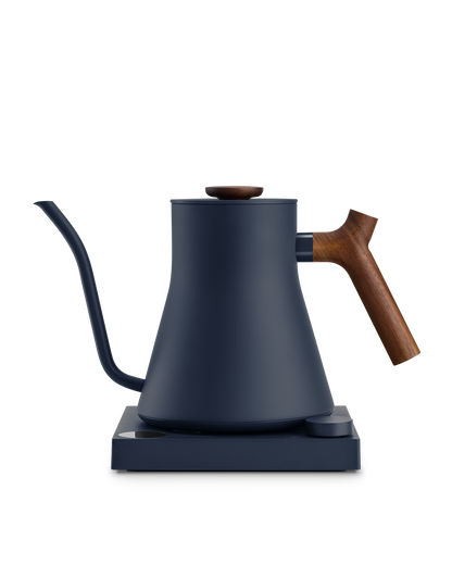 Fellow Stagg EKG electric kettle in matte navy with wooden handle, ideal for precise brewing.
