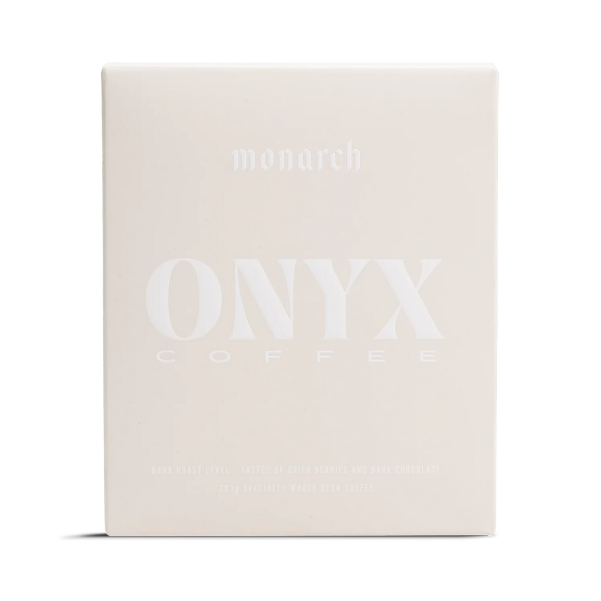 A light beige box labeled Monarch by Onyx Coffee Lab with a rich coffee design.