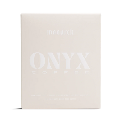 A light beige box labeled Monarch by Onyx Coffee Lab with a rich coffee design.